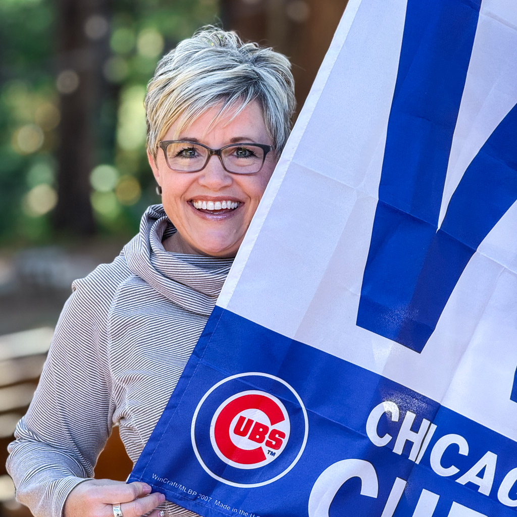 Dr. Tiffany Staman with a Chicago Cubs flag